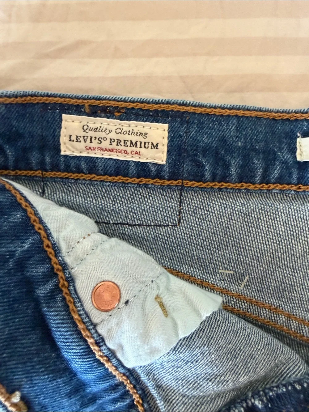 Levi's Blue Denim Asymmetric Raw Hem Jean Shorts